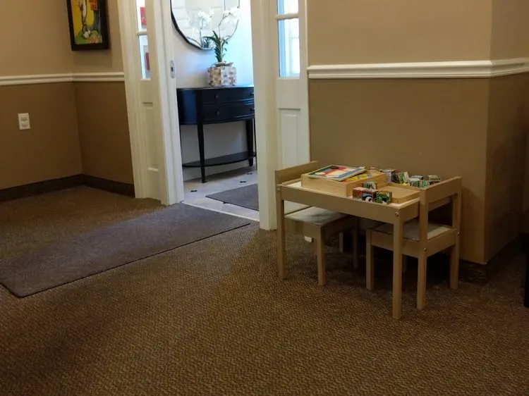 The entrance to the waiting room at Westfield Dental Associates, with a children's play table.
